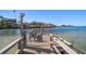 Private dock offering direct access to the serene waterway, complete with boat lift at 103 Shore Dr, Dunedin, FL 34698