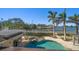 Resort-style pool and spa offer a relaxing retreat with waterfront views and tropical landscaping at 103 Shore Dr, Dunedin, FL 34698