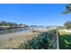 Scenic waterfront featuring private docks and clear waters, perfect for boating and relaxation at 103 Shore Dr, Dunedin, FL 34698