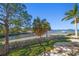 Waterfront property featuring lush lawns, and tranquil bay views at 103 Shore Dr, Dunedin, FL 34698