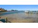 Picturesque view from the property showcasing clear bay waters, neighboring docks, and tranquil waterfront living at 103 Shore Dr, Dunedin, FL 34698