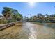Waterway view featuring a private dock and clear waters, ideal for boating and water activities at 103 Shore Dr, Dunedin, FL 34698