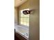 Bathroom featuring a large soaking tub situated by a window, providing a relaxing bathing experience at 18316 Oxenham Ave, Spring Hill, FL 34610