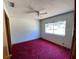 Bedroom with carpet floors, a single window offering plenty of natural light, and neutral-colored walls at 18316 Oxenham Ave, Spring Hill, FL 34610