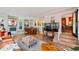 Finished basement with a bar area, kitchenette, lounge seating, tile flooring, and exterior access at 105 17Th Ne Ave, St Petersburg, FL 33704