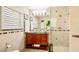 Bathroom with updated fixtures, a vanity with storage, and a glass enclosed walk-in shower at 105 17Th Ne Ave, St Petersburg, FL 33704