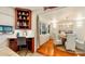 Dining room with hardwood floors, stylish chandelier, and built-in display shelves next to a work area at 105 17Th Ne Ave, St Petersburg, FL 33704