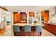 Spacious kitchen featuring custom wood cabinets, granite countertops, stainless steel appliances, and large island at 105 17Th Ne Ave, St Petersburg, FL 33704