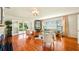 Bright living room with hardwood floors, french doors, modern furniture and large windows providing ample sunlight at 105 17Th Ne Ave, St Petersburg, FL 33704