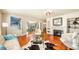 Stylish living room with hardwood floors, fireplace, and seamless flow to other living spaces, offering comfort and elegance at 105 17Th Ne Ave, St Petersburg, FL 33704