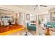 Open living space with seamless transition to dining and sunroom, enhanced by hardwood floors and stylish decor at 105 17Th Ne Ave, St Petersburg, FL 33704