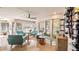 Bright and airy sunroom with terrazzo flooring, comfortable seating, and lots of natural light through large windows at 105 17Th Ne Ave, St Petersburg, FL 33704