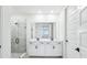Stylish bathroom features double sink vanity and walk-in shower at 1832 Draughton Dr, Zephyrhills, FL 33541