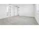 Carpeted bedroom with closet and bathroom at 1832 Draughton Dr, Zephyrhills, FL 33541