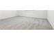 Large carpeted bedroom with a window for natural light at 1832 Draughton Dr, Zephyrhills, FL 33541