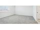 Carpeted bedroom flooded with natural light from the window at 1832 Draughton Dr, Zephyrhills, FL 33541