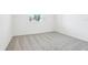 Bedroom with carpet floors, white walls, and a bright window at 1832 Draughton Dr, Zephyrhills, FL 33541