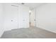 Bedroom with carpet floors, white walls, and double-door closet at 1832 Draughton Dr, Zephyrhills, FL 33541