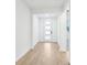 Entryway featuring stylish tile flooring and a modern white front door with glass inserts at 1832 Draughton Dr, Zephyrhills, FL 33541