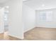 Living room with tiled floors, and light from the windows at 1832 Draughton Dr, Zephyrhills, FL 33541