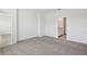 Neutral bedroom featuring carpet, an ensuite, and ample space, ideal for relaxation and personalization at 1852 Brekey Way, Zephyrhills, FL 33541