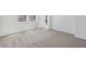 Spacious bedroom showcasing neutral carpet and paint with natural light, creating an inviting and comfortable atmosphere at 1852 Brekey Way, Zephyrhills, FL 33541