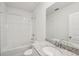 Bathroom features a single sink, granite countertop, and a shower-tub combo at 1860 Brekey Way, Zephyrhills, FL 33541