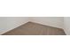 Close-up of a carpeted bedroom corner with white base trim at 1860 Brekey Way, Zephyrhills, FL 33541