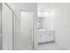 Bright bathroom featuring tiled floors and a modern vanity at 1867 Draughton Dr, Zephyrhills, FL 33541