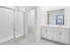 Modern bathroom featuring a glass shower and double sink vanity at 1867 Draughton Dr, Zephyrhills, FL 33541