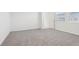 Carpeted bedroom with natural light at 1867 Draughton Dr, Zephyrhills, FL 33541