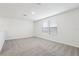 Spacious bedroom with carpet flooring and natural light at 1867 Draughton Dr, Zephyrhills, FL 33541