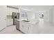 Modern kitchen with island, stainless appliances, and open layout at 1867 Draughton Dr, Zephyrhills, FL 33541