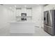 Bright kitchen featuring recessed lights, white cabinets and stainless steel appliances at 1867 Draughton Dr, Zephyrhills, FL 33541