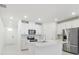 Bright kitchen with recessed lighting, white cabinets, and stainless steel appliances at 1867 Draughton Dr, Zephyrhills, FL 33541