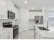 Modern kitchen featuring a center island, stainless appliances, and recessed lighting at 1867 Draughton Dr, Zephyrhills, FL 33541