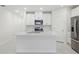 Modern kitchen featuring recessed lighting, white cabinets, and stainless steel appliances at 1867 Draughton Dr, Zephyrhills, FL 33541