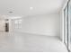 Bright living room featuring tile flooring and natural light from the windows at 1867 Draughton Dr, Zephyrhills, FL 33541