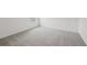 Neutral bedroom with neutral carpet, white trim, and a bright window at 1868 Brekey Way, Zephyrhills, FL 33541