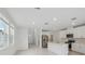 Modern kitchen with stainless steel appliances, center island, and plenty of natural light at 1868 Brekey Way, Zephyrhills, FL 33541