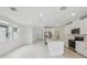Bright, open-concept kitchen features stainless steel appliances and a center island with sink at 1868 Brekey Way, Zephyrhills, FL 33541