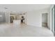 Open-concept living room and kitchen with modern stainless steel appliances and a center island at 1868 Brekey Way, Zephyrhills, FL 33541
