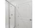 Shower with glass door and white tile at 1868 Brekey Way, Zephyrhills, FL 33541