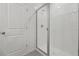 Modern bathroom showcases a walk-in shower with glass door and white tiles at 1886 Draughton Dr, Zephyrhills, FL 33541