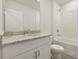 Well-lit bathroom features vanity with sink and bath with shower at 1886 Draughton Dr, Zephyrhills, FL 33541