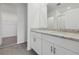 Elegant bathroom features double vanities with stone countertops at 1886 Draughton Dr, Zephyrhills, FL 33541