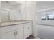 Beautiful bathroom with double vanity sinks, granite countertops, and natural light at 1886 Draughton Dr, Zephyrhills, FL 33541