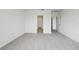 Bright bedroom with neutral carpet, large closet, and ample natural light at 1886 Draughton Dr, Zephyrhills, FL 33541