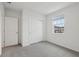 Cozy bedroom with carpet, a sliding-door closet, and a bright window at 1886 Draughton Dr, Zephyrhills, FL 33541