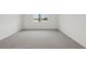 Serene bedroom with neutral carpet, window and view at 1886 Draughton Dr, Zephyrhills, FL 33541